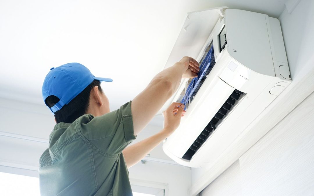 Air conditioning technician maintaining an indoor mini split system in Marana, AZ